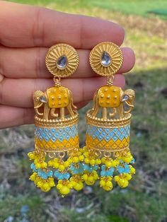 Elephant statement earrings available in 3 colors- navy blue- baby blue/ baby pink- mint green/ yellow- ferozi(blue) Style tip- ----------- Pair it with any beautiful traditional outfits  and flaunt with Unique style of collection from us. Perfect match for Festival and Traditional wear.  Take Care Tips-  ---------------- Kee away from perfume, Hair spray and. Moisture.  Store in dry place , Ziplock bag or Airtight box.    Clean with dry cloth.  Jewellery is the last thing you should wear and fi Handmade Blue Danglers For Wedding, Blue Danglers For Diwali Gift, Blue Tilla Jhumkas For Gift, Blue Temple Jewelry Jhumkas Gift, Blue Kundan Danglers For Gift, Blue Kundan Danglers As A Gift, Blue Chandbalis For Gift, Festive Blue Earrings As Gift, Festive Blue Earrings For Gifts