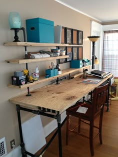 a wooden desk sitting in the middle of a living room