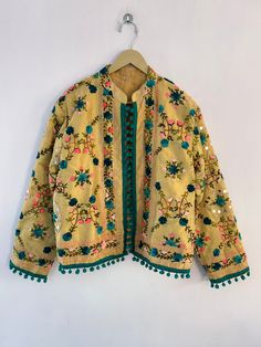 "Woman's jacket cotton Designer embroidery. This jacket was hand-made with vintage style phulkari embroidery by artisans from the nomadic desert tribe known as \"Banjara \", in the Northern India. The Jacket is no closure pattern with Long Sleeves and Vibrant Color  Size : Stitching available in all sizes you want Please Send all your measurements after placing order  Length 23 Inches Sleeve Length 23 Inches Chest - 40 Inches Shipping : Free worldwide shipping. (Note : Design of Embroidery May be change) Assorted Designs Available Condition: New Delivery Policies: . We dispatch your item within 1-3 days after order receive. . After dispatching item nothing in our hand like Exact delivery time. . You are responsible for the duties and taxes of your country. Return Policies: . Shipping charg Festive Cotton Nehru Jacket With Dabka Work, Festive Cotton Nehru Jacket With Floral Embroidery, Folk Style Outerwear With Intricate Embroidery For Spring, Bohemian Embroidered Nehru Jacket For Winter, Folk Outerwear With Intricate Embroidery For Festive Occasions, Bohemian Nehru Jacket With Intricate Embroidery For Winter, Festive Embroidered Nehru Jacket For Spring, Bohemian Nehru Jacket With Intricate Embroidery, Festive Folk Embroidered Outerwear