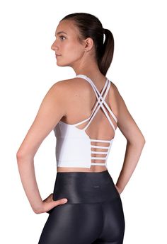 No wardrobe is complete without a white crop top like this stunning piece. Designed with active women in mind, our Finesse bra is the mother of all sporty yet cute crop tops. Its moisture-wicking fabric makes this bra the perfect gym companion, while its delicate back detail will look excellent teamed with relaxed evening wear. Product details - Wear it as a crop top or a medium support sports bra - Removable pads - 4-way stretch design - High neck design adds coverage - Flattering back strap de Fitted Sports Bra With Built-in Bra And Cross Back, Athleisure Strappy Sports Bra With Built-in Bra, Yoga Activewear With Built-in Push-up Bra, Sports Bra With Strappy Back And Built-in Bra, Sports Bra With Built-in Padding For Light Exercise, T-back Sports Bra With Straps For Workout, Strappy Sports Bra With Built-in Bra, Compressive Crop Top With Built-in Padding For Workout, High Stretch Cross Back Sports Bra With Built-in Padding