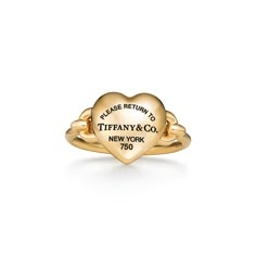 A bold expression of love, inspired by those who fill up your heart. Tiffany artisans have transformed the classic Return to Tiffany® tag into a three-dimensional heart with a special casting technique. The 18k yellow gold pieces in this collection feature layers of black rhodium applied by hand for a striking finish. Playfully proportioned, each heart is hand polished for maximum shine. 18k yellow gold; Motif size, mini | Return to Tiffany® Full Heart Ring in Yellow Gold, Size: 5 1/2 Gold Tiffany Ring, Tiffany Gold Ring, Tiffany Heart Ring, Tiffany And Co Ring, Tiffany Ring, Tiffany Co Rings, Gold Tiffany, Gold Motif, Tiffany Rings