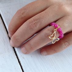 Fuchsia Pink Quartz Stretch Ring with 24k Gold by PiscesAndFishes Adjustable Agate Open Ring Jewelry, Agate Spacer Beads Jewelry Gift, Adjustable Agate Open Ring, Adjustable Crystal Ring With Round Beads For Gifts, Beaded Rings For Jewelry Making, Beaded Toe Ring Jewelry As Gift, Beaded Crystal Ring Gift, Adjustable Beaded Crystal Ring, Pink Beaded Rings For Gift