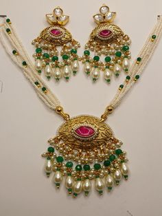 Amdavadi pachi kundan necklace set beautifully intricated with pearl and emerald green coloured drop shaped beads with pearl jumkis Kundan Chandbali Necklace With Pearl Drop, Chandbali Kundan Necklace With Pearl Drop, Festival Kundan Temple Necklace With Pearl Drop, Festive Kundan Temple Necklace With Pearl Drop, Green Kundan Beaded Necklace With Stone Work, Traditional Green Pearl Necklace With Meenakari, Traditional Green Jewelry With Dori Work, Green Dori Work Jewelry For Diwali, Green Pearl Necklace With Meenakari For Festivals