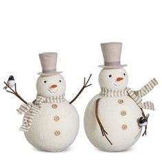 two snowmen with hats and scarves on their heads, one wearing a top hat