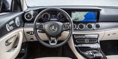 the interior of a mercedes s - class sedan with navigation system and steering wheel controls