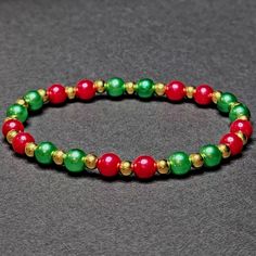 Christmas Beaded Stretch Bracelet Handmade By Me 6mm Red & Green Faux Pearls Fits 6-7" Wrist New Festive Christmas Beads With Round Shape, Festive Christmas Beads, Christmas Festive Round Beads, Christmas Green Beaded Bracelets, Red Beaded Bracelets With Colorful Beads For Christmas, Red Beaded Bracelet With Colorful Beads For Christmas, Red Beaded Bracelets With Round Beads For Holiday, Holiday Red Beaded Bracelets With Round Beads, Red Beaded Bracelets For Holidays