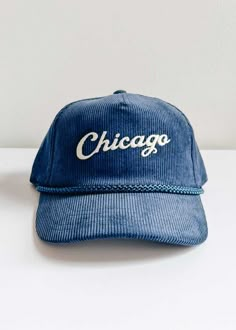 *Alice & Wonder Exclusive* Corduroy 5-panel hat with soft structured crown and slight curved visor. Braided nylon cord across seam and plastic adjustable snap closure. Featuring a matte embroidered 'Chicago' on the front. Cheap Blue Casual Snapback Hat, Cheap Navy Trucker Hat With Curved Brim, Cheap Trendy Flat Bill Baseball Cap, Adjustable Trucker Hat With Embroidered Logo And Flat Brim, Adjustable Snapback Trucker Hat With Embroidered Logo, Adjustable Embroidered Snapback Hat, Adjustable Curved Bill Trucker Hat For Everyday, Vintage Adjustable Snapback Hat With Curved Brim, Retro Adjustable Snapback Baseball Cap