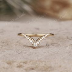 Unique Moissanite Wedding Band Yellow Gold Moissanite Curved Wedding Ring Art Deco Stacking Matching Chevron Ring Promise Rings For Women ITEM DETAILS ●Available in yellow, white or rose solid 10k, 14k or 18k gold. This ring can be made in Platinum. ❀❀Wedding band  Stone: Moissanite Shape: Round Shape Weight: about 0.106ct Band width around 1.3mm Visit my shop for more jewelry: https://www.etsy.com/shop/TheRoseCastle if you would like to customize your unique ring, you may contact us about your ideas and pictures. Hope I could get the chance to create fabulous rings for you! ❀Production ---- This ring is handmade and very good quality! Please allow 2-4 weeks for production. It can be made to any ring size.  ❀Engraving service We accept the engraving order, leave a note when placing an orde Yellow Gold Chevron Wedding Band, Marquise Rings, Chevron Wedding Band, Wedding Band Yellow Gold, Curved Wedding Ring, Wedding Ring Art, Wedding Rings Art, Chevron Wedding, Wishbone Ring