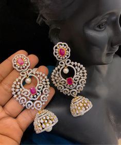 Elevate your look with these striking Royal Look Large CZ Jhumka Drop Earrings. Handcrafted from brass, this chic jhumka style is adorned with cubic zirconia stones for a glamorous effect. Perfect for special occasions, these earrings are sure to make you shine. Royal Look, Kundan Necklaces, Cz Jewelry, American Diamond, Temple Jewellery, Elevate Your Look, Indian Design, Stone Necklace, Stone Jewelry