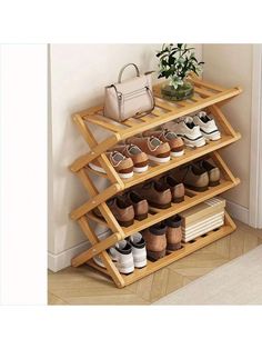 a wooden shoe rack with several pairs of shoes on it and a handbag next to it