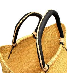 The U- shopper basket is the perfect tote, beach bag, shopper, everyday bag, or home decor basket. | The U- shopper basket is the perfect tote, beach bag, shopper, everyday bag, or home decor basket. The beautiful bolga baskets are hand- woven in small villages of Ghana, a tradition passed down from generation to generation. They are woven out of renewable resources, including banana leaf and elephant grass, which grow abundantly in the region. Each basket is hand woven and 100% unique! Colors w Summer Basket Bag With Rolled Handles, Beach Bag With Rolled Handles In Natural Fiber, Everyday Beach Bag With Round Handles, Beach Tote Bag With Rolled Handles For Shopping, Shopping Beach Tote With Rolled Handles, Rectangular Beach Bag With Handles For Shopping, Bucket Bag With Rolled Handles For Beach, Beach Bag With Braided Double Handles For Shopping, Shopping Bucket Beach Bag With Handles