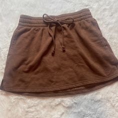 Nwot Victoria’s Secret Pink Skirt Size: Xs - Adjustable Strings -Pockets Smoke Free New To Poshmark? Use Referral Code Justfoxii When You Sign Up For Poshmark And Get $10 Posh Credit! Brown Cotton Skort, Brown Cotton Mini Skirt With Pockets, Brown Mini Skort With Pockets, Casual Brown Short Skort, Brown Mini Skirt With Pockets, Casual Brown Skort With Pockets, Sporty Relaxed Skirt With Pockets, Casual Short Cotton Skirt, Casual Brown Lined Skirt