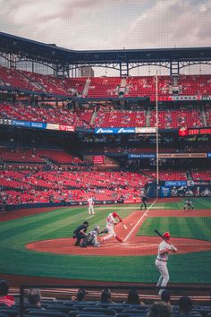 a baseball game in progress with the batter up to plate