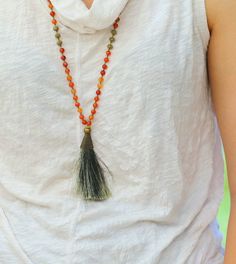 "Complete a boho-chic look with this statement necklace. A beautiful bead necklace made stunning by Carnelian stones and an olive green tassel. Bring these warm and cool colors to your ensembles with this mala necklace. Product Details: ---------------------- Materials: *carnelian stone Measurements: Length of the tassel: 3 \"/ 7.6 cm. Chain length 30\" / 76cm Why purchase this Mala Necklace? Carnelian is known as the \"Stone of Joy\" ✅ The necklace are expertly handmade with craftsmanship and h Bohemian Faceted Beads For Festival, Orange Bohemian Hand-strung Beaded Necklace, Bohemian Faceted Beads Necklace For Festival, Bohemian Crystal Necklaces With Faceted Beads For Healing, Bohemian Hand-strung Orange Beads, Hand-strung Orange Bohemian Beads, Bohemian Orange Hand-strung Necklace, Bohemian Beaded Necklaces With Faceted Beads For Festivals, Bohemian Crystal Necklaces With Faceted Beads For Beach