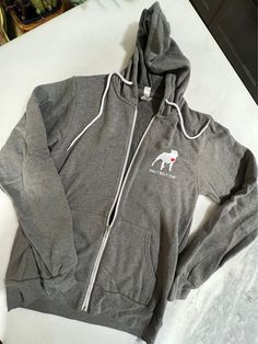 A unsex, full zip, fleece hoodie. Winter Athletic Heather Sweatshirt With Drawstring Hood, Winter Sweatshirt With Drawstring Hood In Athletic Heather, Fitted Athleisure Sweats For Winter, Heather Grey Sports Hoodie For Winter, Winter Sports Hoodie In Heather Grey, Winter Sports Heather Grey Hoodie, Fitted Hooded Sweatshirt Casual, Casual Athletic Heather Sweatshirt For Winter, Heather Grey Winter Hoodie Sweats