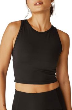 Superior stretch and comfortable support define this racerback tank made with an internal shelf bra that helps you focus on your next personal best. 15" length (size Medium) Partially lined Jewel neck Racerback 95% polyester, 5% elastane Machine wash, tumble dry Made in the USA of imported fabric