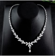 Sparkling Cubic Zirconia Jewelry Set for Brides: Necklace, Earrings, and Bracelet - WonderlandByLilian Elegant Hand Set Bridal Necklace For Evening, Elegant Bridal Necklace For Evening, Hand Set, Elegant Cubic Zirconia Bridal Necklace For Formal Occasions, Elegant Crystal Rhinestone Necklace For Formal Occasions, Elegant Rhinestone Crystal Necklace For Formal Occasions, Elegant Diamond White Cubic Zirconia Bridal Necklace, Elegant Formal Crystal Rhinestone Necklace, Elegant Diamond White Rhinestone Necklace With Sparkling Stones, Formal Bridal Necklace With Sparkling Stones In Diamond White