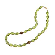 This bright lemon chrysoprase beaded necklace is a celebration of this beautiful light green stone. It is strung with two of our signature crownwork® finials and finished with an 18k yellow gold lilypad clasp. This one of a kind piece looks great layered with other necklaces or worn as a statement on its own. MATERIAL: 18k Yellow Gold STONE TYPE: Lemon Chrysoprase DIMENSIONS: 20" 18th Wedding Anniversary, Swords Medieval, Gold Stone, Summer Jewelry, Beautiful Lights, Lily Pads, Green Stone, Finials, Precious Metals