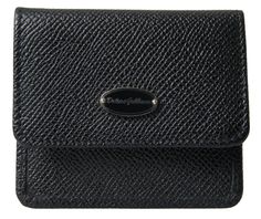 Indulge in the luxury of a Dolce & Gabbana hallmark piece with this elegant coin purse wallet. Crafted from premium black leather, this stylish accessory is a blend of Italian craftsmanship and timeless design. Featuring a compact bifold structure, it provides a sophisticated way to organize your coins and cards, accented with the distinctive logo plaque for an unmistakable touch of class. Constructed with exquisite attention to detail, this wallet exudes quality and luxury, making it the perfect addition to your everyday essentials or a special gift for a loved one.
Color: Black
Material: 100% Leather
Country of origin: Italy Coin Slot, Coin Purse Wallet, Black Textures, Bifold Wallet, Dolce & Gabbana, Leather Accessories, Stylish Accessories, Designer Bags, Satchel Bags