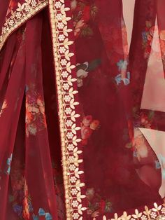 Spread the aura of freshness with our fascinating Maroon Floral Printed Organza Festival Wear Saree. This saree is perfect for adding a touch of elegance and charm to any occasion, be it a party, festival, or special function. Crafted with utmost care, this saree is made from high-quality organza fabric, known for its lightweight and sheer texture.
The prominent maroon color of this saree is beautifully adorned with intricate floral print work all over. The exquisite detailing of gota patti and Marron Color, Work Engagement, Blouse Colour, Organza Material, Sheer Texture, Dori Work, Maroon Saree, Printed Organza, Saree Work