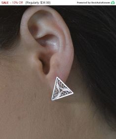 beautiful triangle filigree stud earrings Simple. Everyday. Pretty. Minimalist size of the earrings is 1.00X1.00cm 0.40X0.40inch The earrings will be packed in a gift box with an organza bag, ready to be given also as a gift. Earrings comes with silicone clutches. If you prefer sterling silver or goldfilled clutches please visit this link: https://www.etsy.com/il-en/listing/227385476/add-a-pair-of-sterling-silver-or-14k?ref=pr_shop For more of my earrings collection ~~ https://www.etsy.com/il-en Triangle Pierced Earrings As Gift, Hypoallergenic Triangle Earrings For Gift, Triangle Earrings As Gift, White Triangle Earrings For Gift, Triangle Pierced Earrings Gift, Minimalist Triangle Nickel-free Earrings, Sterling Silver Geometric Earrings, Elegant Triangle Sterling Silver Earrings, Elegant Triangle Metal Earrings