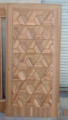 a wooden door with an intricate design on the front and side doors, made out of wood