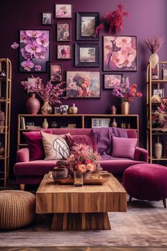 a living room with purple walls and pictures on the wall above the couch, coffee table