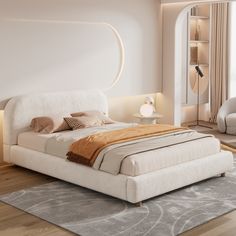 a bedroom with a large bed and white furniture