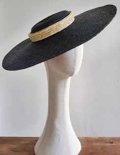 This is a black straw hat with a shallow crown and a large brim. A classic summer hat perfect for any occasion. The hat is free size and attaches with a discreet millinery elastic, worn around the back of the head. It lhas black grosgrain ribbons attached on both sides of the inside belt. These can be tied under the chin, or backside of your neck. Height of the crown:4cm Width of the brim: 13,5 cm Adjustable Straw Panama Hat With Structured Crown, Adjustable Panama Hat For Formal Summer Events, Chic Curved Brim Panama Hat For Parties, Wide Brim Straw Hat For Kentucky Derby Evening, Classic Wide Brim Boater Hat For Evening, Formal Wide Brim Straw Hat For Royal Ascot, Chic Sun Hat For Royal Ascot Races, Evening Fedora Straw Hat, Elegant Toquilla Straw Hat Bands For Vacation