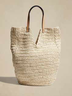 Straw Tote Bag | Banana Republic Factory Chic Sand-colored Straw Tote Bag, Neutral Straw Tote Bag For Shopping, Neutral Straw Bag With Braided Handles For Shopping, Neutral Woven Straw Bag For Shopping, Everyday Sand-colored Straw Tote Bag, Sand-colored Straw Tote Bag, Neutral Straw Tote Bag, Neutral Color Straw Tote Bag, Sand-colored Straw Tote Bag With Braided Handles