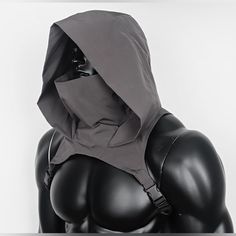 a black mannequin with a hood on it's head and no shirt