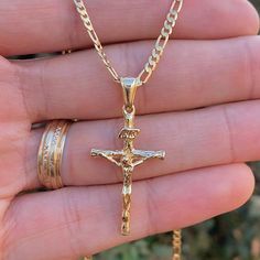 Embrace Timeless Style And Faith With Our Rustic Cross Necklace, Featuring A Uniquely Crafted Cross With A Diamond Cut Design That Adds A Touch Of Brilliance To Its Rugged Charm. Paired With A Classic Valentino Chain, This Necklace Is Both Versatile And Elegant, Making It A Perfect Accessory For Both Men Product Details Material: 14k Gold Filled Metal Purity: 14k Chain Size: 24" Inches Chain Thickness: 2.3mm Pendant Size: 33x18mm Chain Style: Figaro Link Gender: Male Clasp Type: Lobster Claw Age Men’s Crucifix Necklace, Jewelry Men Gold, Mens Gold Cross Necklace, Gold Cross Chain For Men, Aesthetic Chains Men, Necklace Men’s Gold, Gold Mens Jewelry, Jewelry Men Aesthetic, Cross Chain Men