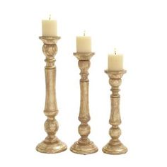 three candles are sitting next to each other