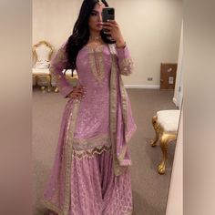 Lavender Sharara Outfit Can Be Used For Any Type Of Event But I Wore It To A Mehendi (Henna Party) Only Worn Once. In Great Condition. Offers Are Welcome. 3 Pieces- Top, Pants, & Dupatta. Jewelry Not Included. Elegant Purple Salwar Kameez With Gota Work, Elegant Purple Anarkali Set With Gota Work, Purple Salwar Kameez With Gota Work For Wedding, Purple Lehenga With Gota Work, Purple Gota Work Lehenga, Bollywood Style Lavender Sharara With Mirror Work, Elegant Lavender Sharara With Zari Work, Traditional Lavender Sharara For Reception, Anarkali Lavender Sharara For Reception