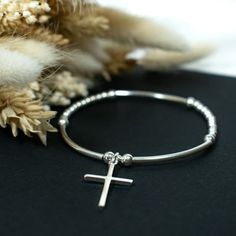 ⭐️925 Sterling Silver Cross Charm Bead Bracelet⭐️ ⭐️   CHARM / BEAD SIZES:  2, 2.5, 3 & 4mm round Beads 30x2mm curved bars 26mm Cross Charm ⭐️ MATERIALS:  925 Sterling Silver, High Quality Jewellery Elastic, Specialist Jewellery Cement.  ⭐️  SIZES:  Standard 17cm / 6.70 inches (Approx inner circumference) Large 19cm / 7.50 inches (Approx inner circumference).  N.B. We are happy to make bespoke sizes, please contact us for more information.  ⭐️  Handmade By us in UK ⭐️ PACKAGING:  Each item arriv Silver Cross Bracelets For Gifts, Sterling Silver Rosary Bracelet With Round Beads As Gift, Sterling Silver Rosary Bracelet With Round Beads, Sterling Silver Rosary Bracelet Gift, Silver Cross Bracelet, Spiritual Style, Nickel Free Sterling Silver Stretch Bracelet Gift, Sterling Silver Stretch Bracelet Gift, Sterling Silver Round Stretch Bracelet Gift, Silver Rosary Bracelet With Charms As Gift