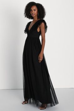 We can't wait for the perfect occasion to come around so we can stun everyone with the Lulus Simply Delighted Black Mesh Ruffled Backless Maxi Dress! This stunning dress is composed of sheer mesh fabric (atop a matching knit liner) that shapes wide straps adorned with flouncy ruffled trim, wide straps, and a sleeveless bodice with a sultry backless design. A high, banded waist tops a twirl-worthy, A-line skirt that cascades down to a sweeping maxi hem. Hidden back zipper/clasp. Fit: This garment Sheer Maxi Dress For Gala During Prom Season, Sheer V-neck Maxi Dress For Evening, Party Dress With Mesh Sleeves And V-neck, V-neck Party Dress With Mesh Sleeves, Elegant Mesh Dress With Sheer Back, V-neck Mesh Party Dress, Chic Mesh Dress With Sheer Back, Chic V-neck Mesh Dress For Evening, Black Floor-length Mesh Dress For Evening