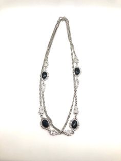 This fabulous necklace looks just as current and trendy as when it was made! Made by Sarah Coventry, it features a lovely silver tone chain with stunning black rhinestone and scrollwork stations. Measuring 36" long, it is in excellent vintage condition. Thank you so much and happy shopping! Vintage Silver Delicate Chain Necklace, Vintage Silver Chain Necklace With Delicate Chain, Black Metal Rhinestone Necklace With Chain, Sarah Coventry, Black Rhinestone, Coventry, Gift For Women, Vintage Silver, Costume Jewelry