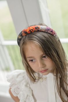 The Alexis Foliage Print Headband is a padded headband for girls that features beautiful foliage print fabric. The headband is designed to be comfortable and lightweight, perfect for everyday wear. The vibrant foliage print adds a touch of fun to any outfit. Made to match our Alexis Collection 100% Polyester Lined for comfort Suitable for 2 Years and older Made in Turkey Care Instructions: Spot clean only. Foliage Print, Padded Headband, Girls Headbands, Signature Design, Print Fabric, Printing On Fabric, Care Instructions, For Girls, Everyday Wear