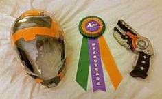 a helmet and some ribbons on a bed