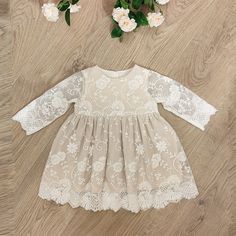 This is very pretty baby/toddler dress in beige and ivory tones. Ivory lace over beige/ecru base fabric, this stylish dress can be worn for baptism/ christening or to a wedding, or any other special occasion. The dress is made from soft pleasant fabrics, so that baby does not feel iritated.  The dress is available from baby up to size 3T Long Sleeve Beige Lace Dress With Patchwork, Beige Long Sleeve Lace Dress With Patchwork, Cream Party Dress With Delicate Lace, Elegant Long Sleeve Cream Lace Dress, Spring Dresses With Delicate Lace And Long Sleeves, Off White Lace Dress For Baptism, Off-white Lace Dress For Baptism, Beige Long Sleeve Dress For Wedding, Long Sleeve Lace Dress With Lace Work