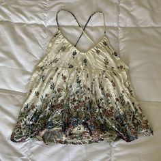 Urban Outfitters Women’s Open Back Crisscross Tank Top. Floral With Key Hole In The Front. Never Worn. Size M But Fits Closer To A Small Bohemian V-neck Camisole For Spring, Spring Bohemian V-neck Camisole, Spring Sleeveless Camisole With Crisscross Straps, Casual Flowy Camisole For Beach, Flowy Casual Camisole For The Beach, Bohemian Floral Print Camisole For Spring, Bohemian Floral Print Camisole For Vacation, Fitted Cross Back Summer Tops, White Cross Back Tank Top For Summer