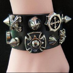 This stylish punk gothic cuff bracelet comes with studs for a cool look and has two circumference positions: 6.5" and 7.5" to fit most wrists (16-19 cm). Edgy Black Cuff Bracelet With Rivets, Punk Style Adjustable Cuff Bracelet With Rivets, Punk Adjustable Cuff Bracelet With Rivets, Adjustable Punk Cuff Bracelet With Rivets, Adjustable Black Band Punk Cuff Bracelet, Adjustable Punk Cuff Bracelet With Black Band, Black Band Wristband For Concerts, Adjustable Black Punk Wristband, Adjustable Black Cuff Bracelet Punk Style