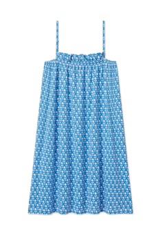 a women's blue dress with white flowers on it