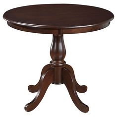 a round wooden table with two pedestals on one end and an oval base on the other