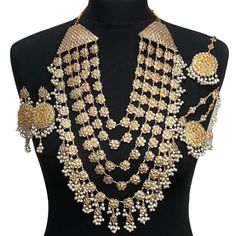 Pakistani bridal set. Includes- Mala Jhumar Tikka Earrings Meenakari Jewelry For Marriage On Diwali, Tilla Jewelry For Marriage And Festivals, Meenakari Jewelry For Marriage And Diwali, Bollywood Style Gold Bridal Accessories With Hand Set Details, Hand Set Gold Bollywood Bridal Accessories, Gold Chandbali Bridal Accessories Hand Set, Gold Chandbali Jewelry Sets For Wedding, Gold Chandbali Bridal Accessories With Stone Work, Gold Chandbali Hand Set Bridal Accessories