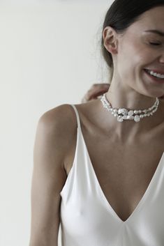 A myriad of pearls, including freshwater + Swarovski, intertwine + wave to create this wildly elegant choker— finished with ivory velvet ties. Feeling forward? We love styling it as a statement necklace with a minimalist gown.

#bridalstyling #personalstylist #whattowear #grwm #stylingadvice #wedding #bridal #modernaesthetic #style #womensfashion #womenstyle Chic Pearl Necklace For Wedding, Chic Evening Pearl Necklace, Elegant Bridal Choker Necklace, Chic Pearl-embellished Pearl White Jewelry, Elegant White Single Strand Choker, Elegant Single Strand White Choker, Elegant Formal Bridal Choker Necklace, Elegant Baroque Pearl Choker, Chic Pearl White Choker Jewelry