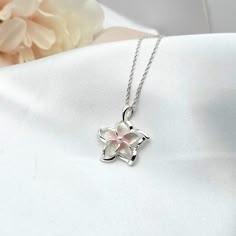 This Sterling Silver Rainbow Plumeria Necklace is the perfect accessory for anyone looking to add a touch of Hawaiian-inspired style to their look. Crafted with 925 sterling silver, this beautiful necklace features a colorful plumeria flower surrounded by intricate detail. The ideal beach gift, this plumeria pendant is sure to make a lasting impression. - Comes ready to wear on a 925 sterling silver chain of your choice length. Comes standard on a box style chain.  - solid sterling silver plumer Sterling Silver Flower Charm Necklace, Sterling Silver White Gold Flower Necklace, Sterling Silver Flower Pendant Necklace As Gift For Her, White Gold Sterling Silver Flower Necklace, White Sterling Silver Flower Necklace, Pink Flower-shaped Sterling Silver Necklace, Pink Flower Shaped Sterling Silver Necklace, Plumeria Necklace, Silver Flower Necklace