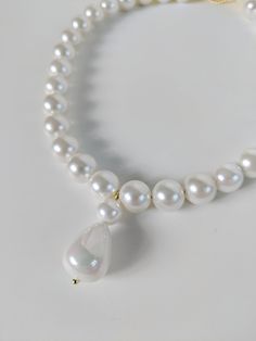 This listing is for a reproduction 18th Century necklace made with medium white Shell Pearls. Shell Pearls are beads made from the nacre of Pearls so they have the weight and shine of real Pearls without the high cost. These are medium-sized 8mm beads. This short necklace (13") is finished with two rings on the end, which you run a ribbon through to tie it on. 18th Century necklaces were meant to be worn very short on the neck in a true choker fashion, so the ribbons allow it to be totally adjus Two Rings, Real Pearls, Short Necklace, How To Make Beads, 18th Century, The End, Pearl Necklace, Shells, Beads