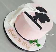 a wedding cake with the bride and groom's silhouette on it