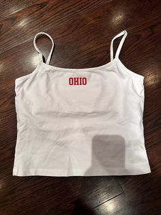 Experience the ultimate comfort and style with our 100% cotton, printed tank featuring a built-in bra and flattering cropped waist fit. Feel confident and supported all day long! Ohio Stadium, Brand Ambassador, Print Tank, Feel Confident, Auburn, Vintage Collection, Best Sellers, Ohio, Built In